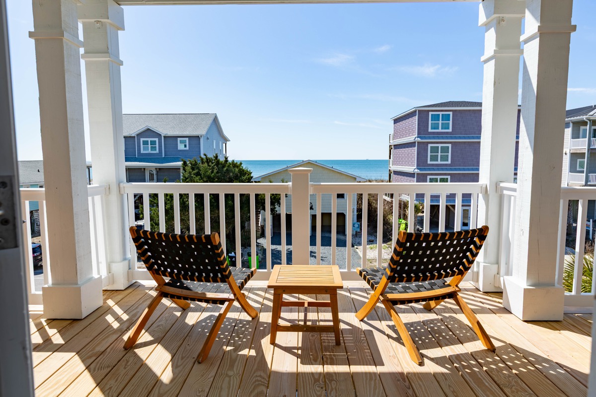 Upper porch with chairs and an ocean view