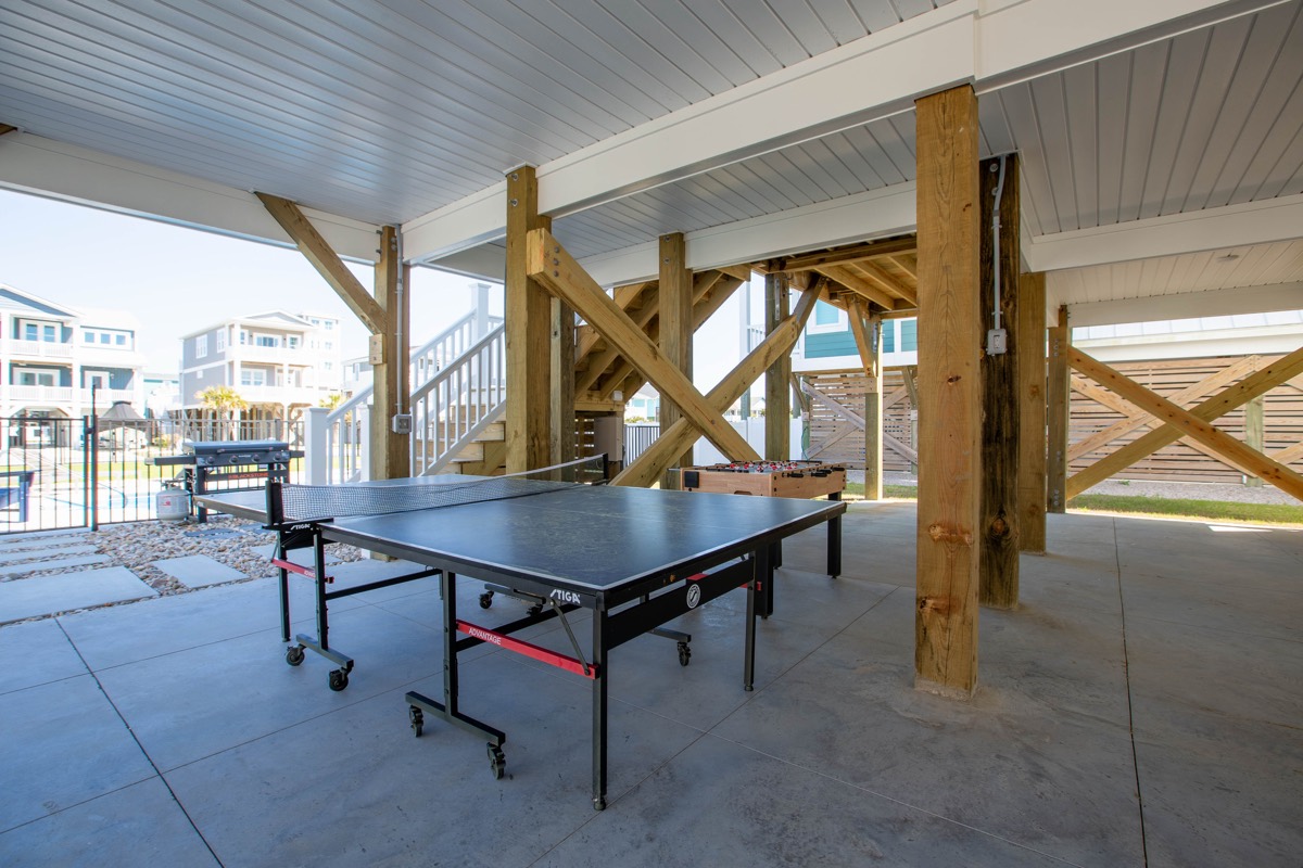 Ping-pong table in the covered area under the house