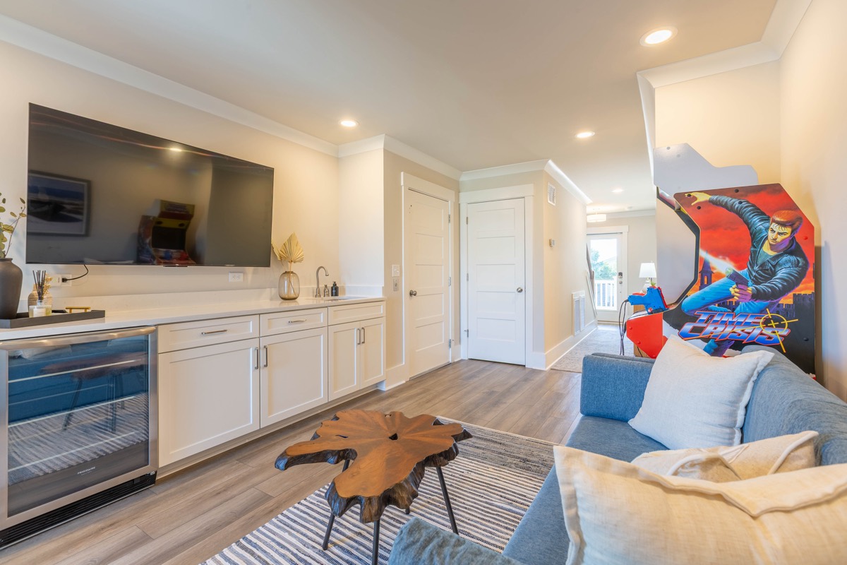 Game room with TV, beverage fridge and arcade cabinet
