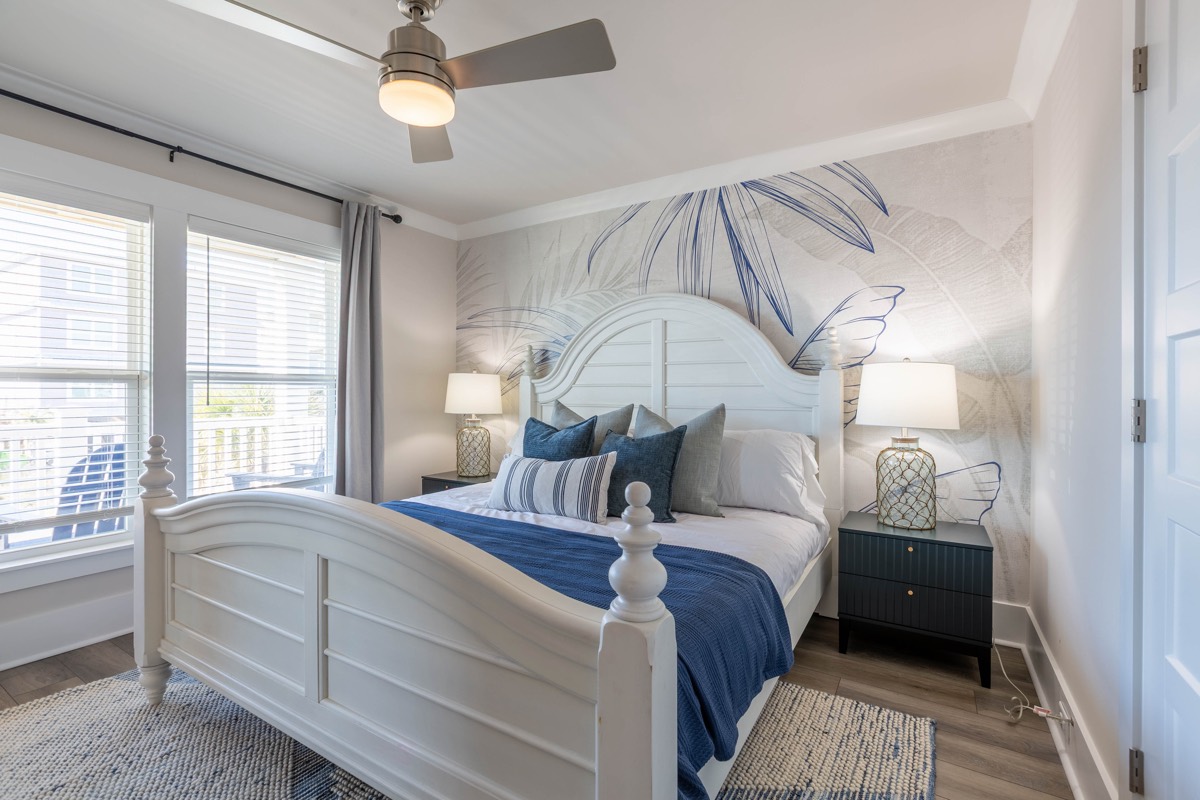 Bedroom with a palm-leaf mural