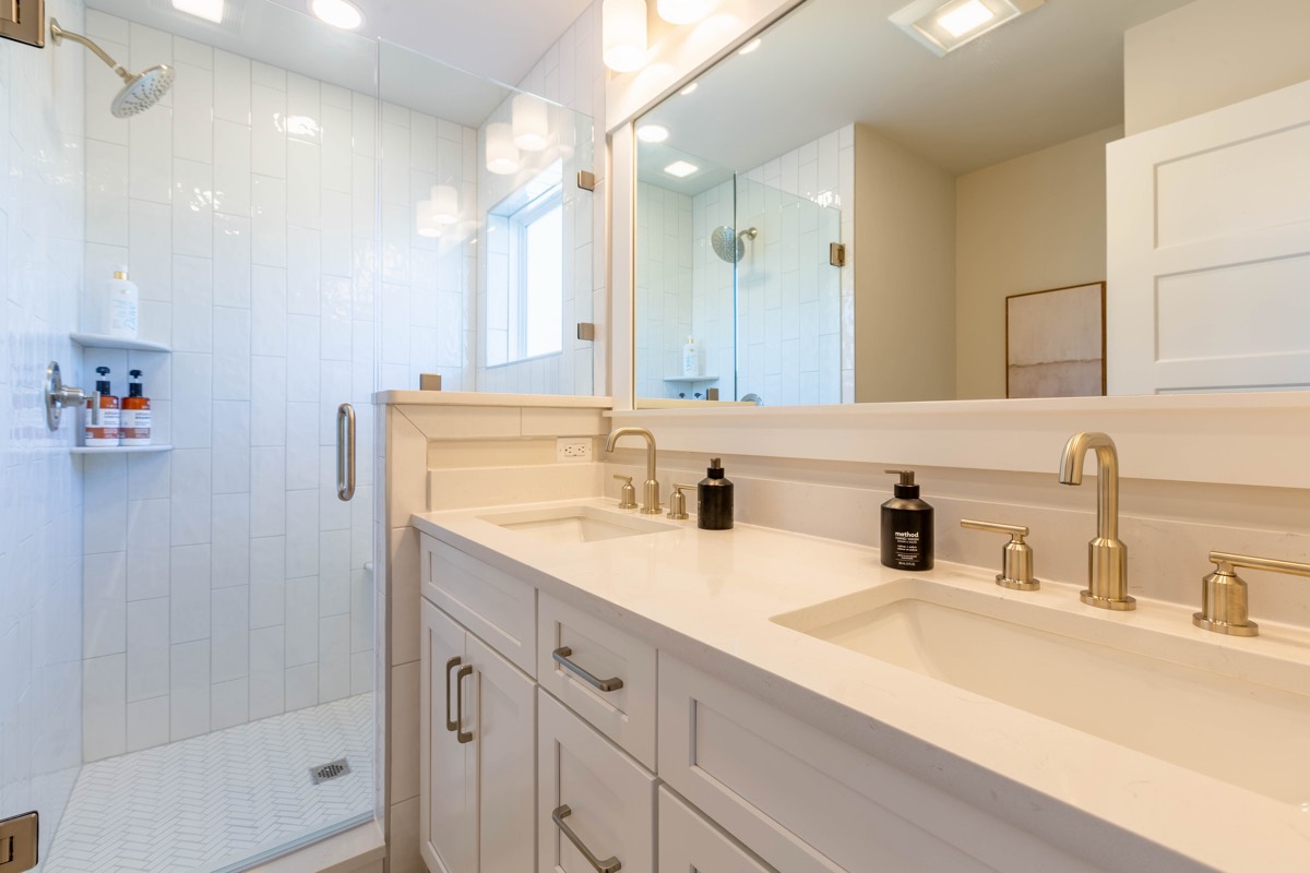 Double-vanity bathroom with walk-in shower