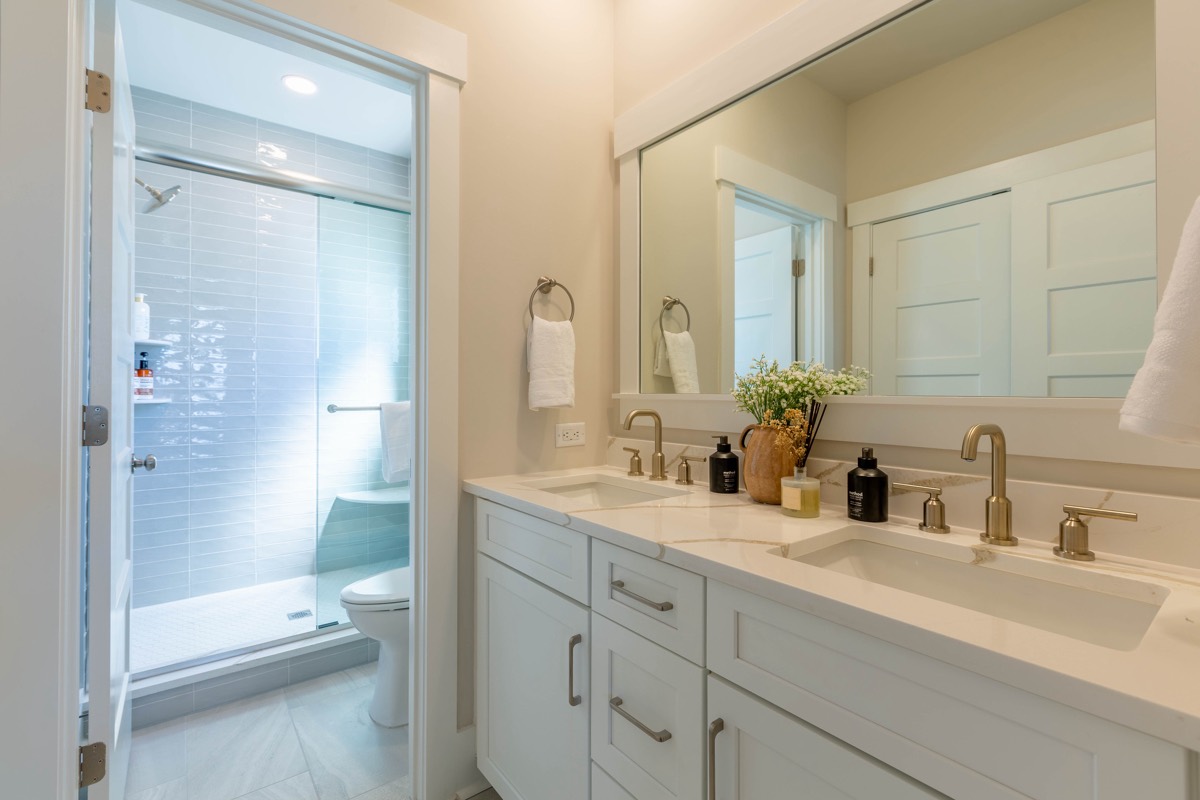 Double-vanity bathroom with glass shower